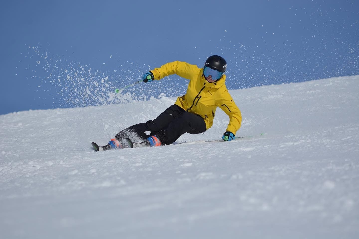 Private ski instructor teaching on sunny Alpine slopes in Europe